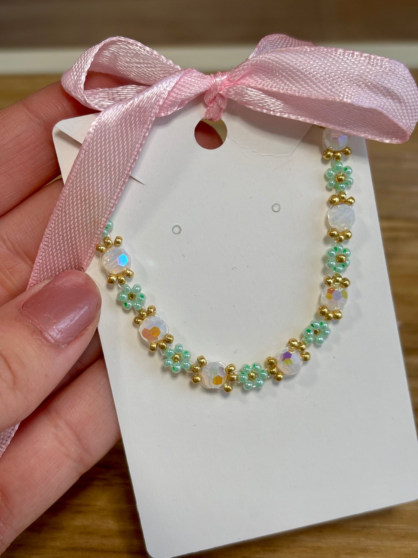 Bracelet fleurs vert d’eau