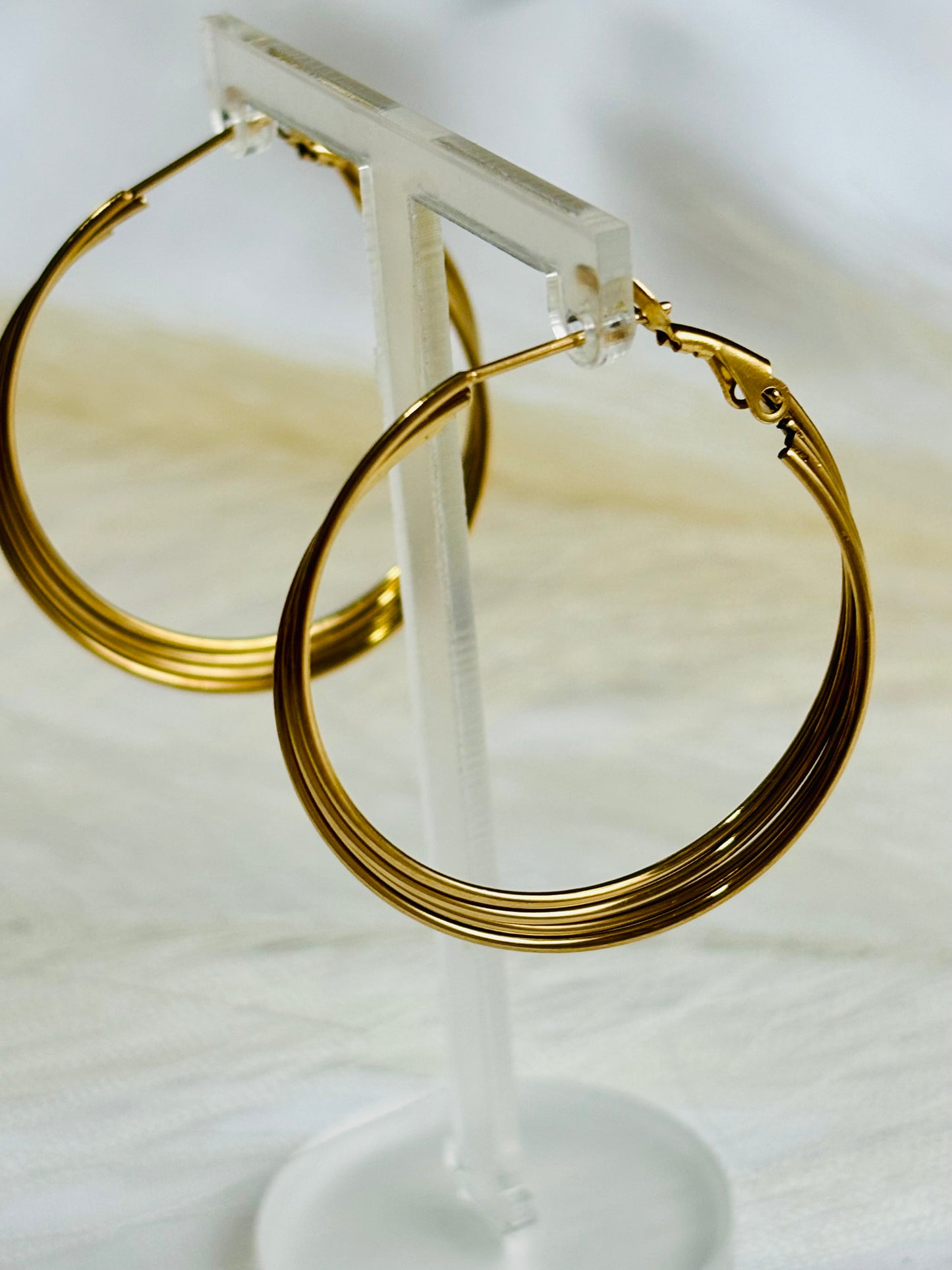 Boucles d’oreilles créoles entrelacés